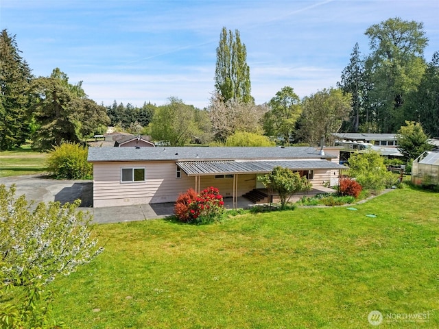 3180 Woodcock Rd, Sequim, WA 98382 - rear view of house with a yard