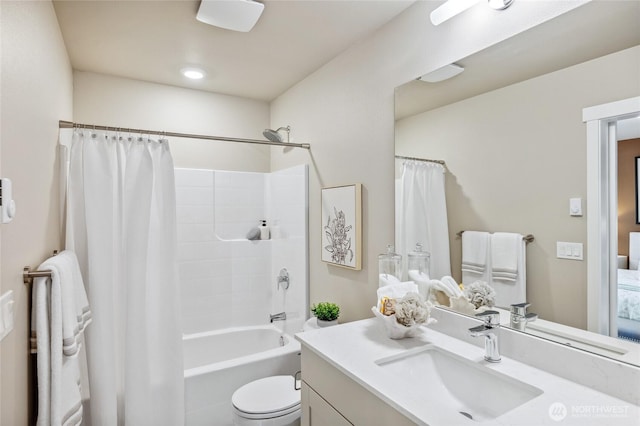 bathroom featuring vanity, toilet, and shower / bath combination with curtain