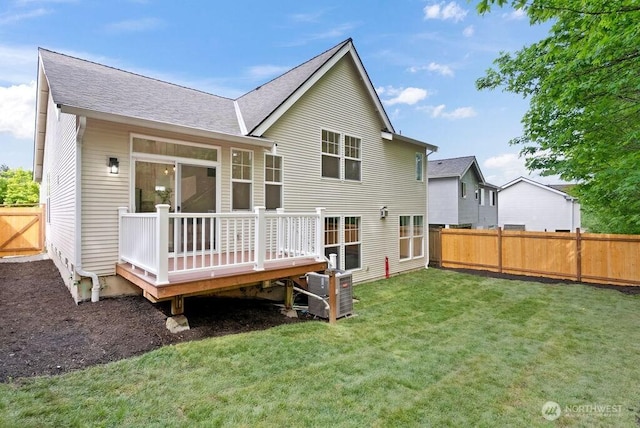 back of house with a wooden deck, roof with shingles, and central AC unit