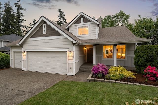 28132 24th Pl S, Federal Way, WA 98003 - view of front of home featuring driveway, a garage, a shingled roof, covered porch, and a lawn