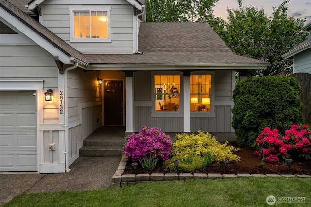 28132 24th Pl S, Federal Way, WA 98003 - view of exterior entry with roof with shingles, a porch, and a garage