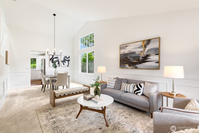 28132 24th Pl S, Federal Way, WA 98003 - living room with a decorative wall, wainscoting, a chandelier, light colored carpet, and high vaulted ceiling