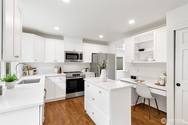 28132 24th Pl S, Federal Way, WA 98003 - kitchen featuring appliances with stainless steel finishes, a sink, a center island, open shelves, and white cabinets
