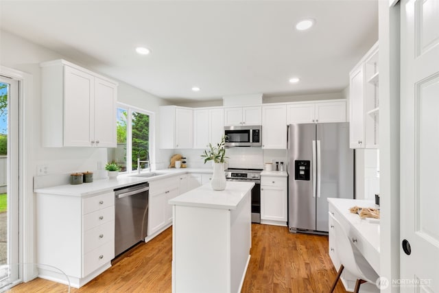 28132 24th Pl S, Federal Way, WA 98003 - kitchen featuring stainless steel appliances, a sink, light countertops, light wood-style flooring, and recessed lighting