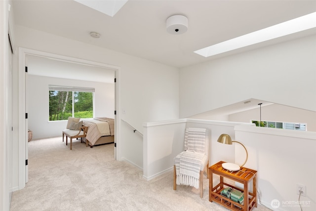 28132 24th Pl S, Federal Way, WA 98003 - hallway featuring a skylight, carpet flooring, baseboards, and an upstairs landing