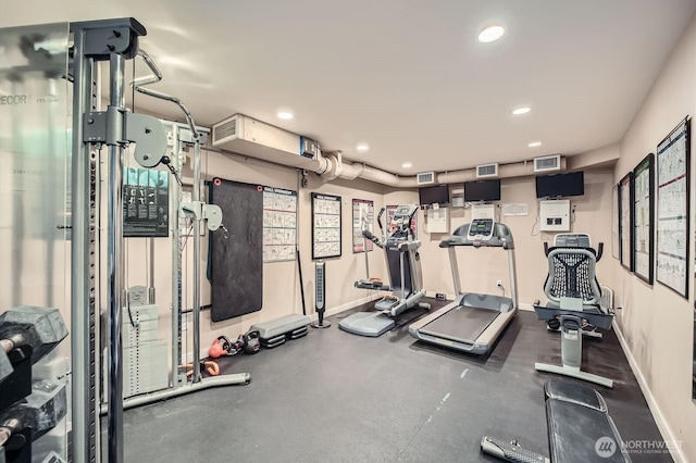 gym with recessed lighting and baseboards
