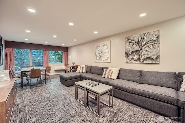 living area with recessed lighting and carpet flooring
