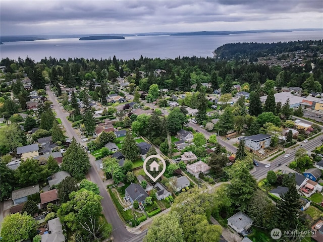 aerial overview of property's location featuring a nearby body of water and nearby suburban area