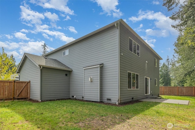 back of property with a patio area and crawl space