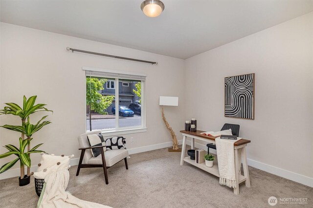 carpeted home office with baseboards