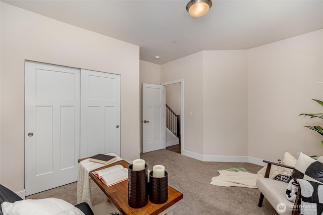 carpeted office space featuring baseboards