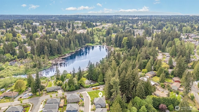 view of property location with a nearby body of water and nearby suburban area