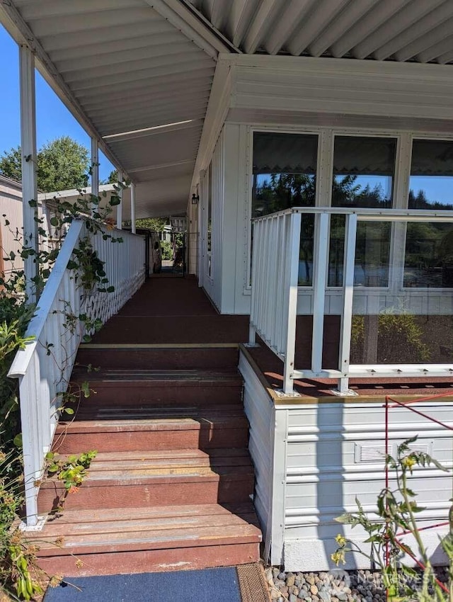property entrance featuring board and batten siding and a porch