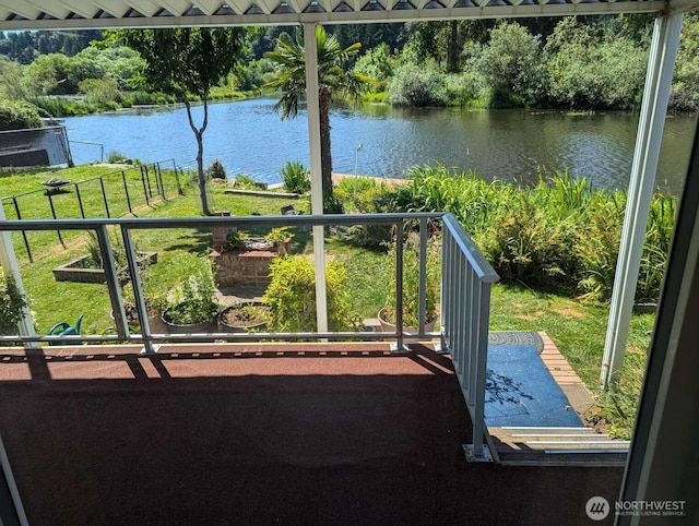 balcony featuring a water view