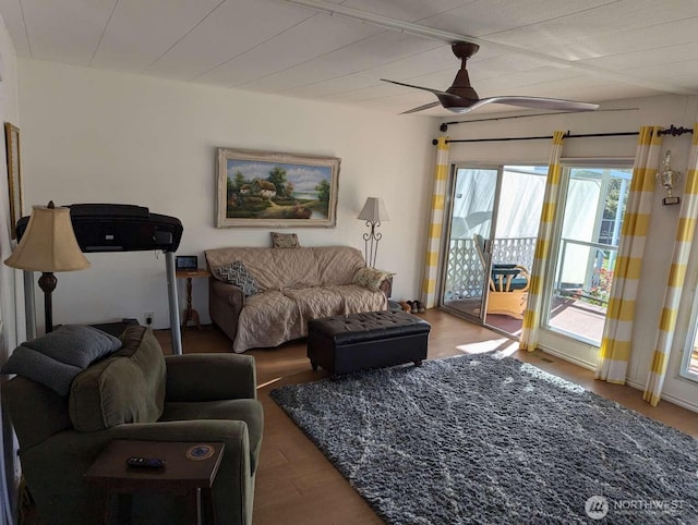 living area featuring ceiling fan and wood finished floors