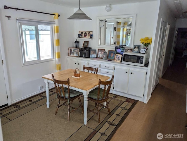 dining space featuring light wood-style flooring