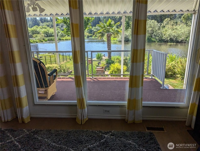 7301 NE 175th St Unit 140, Kenmore, WA 98028 - entryway featuring a water view and view of wooded area