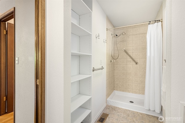 bathroom featuring a stall shower