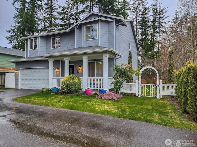 2332 130th Pl SE, Everett, WA 98208 - view of front of property with a porch, a gate, an attached garage, and asphalt driveway