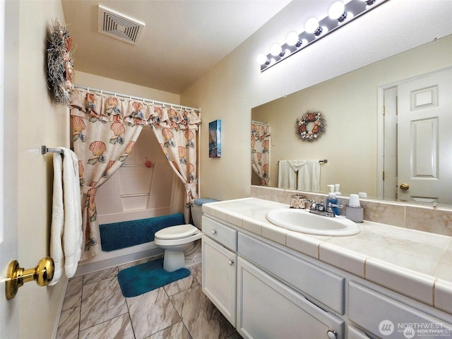 2332 130th Pl SE, Everett, WA 98208 - full bath with toilet, vanity, marble finish flooring, and shower / tub combo