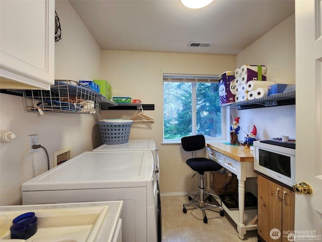 2332 130th Pl SE, Everett, WA 98208 - washroom featuring cabinet space, washing machine and clothes dryer, and baseboards