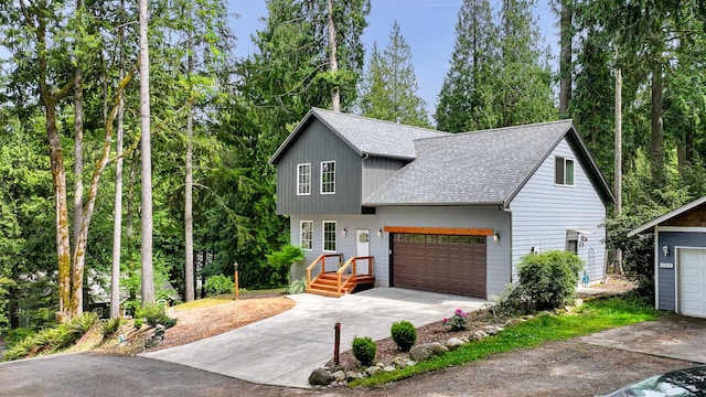 132 Sudden Valley Dr, Bellingham, WA 98229 - view of front of property with roof with shingles, concrete driveway, and a garage