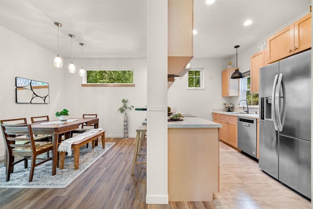 132 Sudden Valley Dr, Bellingham, WA 98229 - kitchen with appliances with stainless steel finishes, light brown cabinetry, a sink, healthy amount of natural light, and recessed lighting