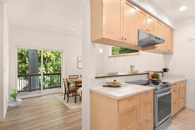 132 Sudden Valley Dr, Bellingham, WA 98229 - kitchen with electric stove, under cabinet range hood, light brown cabinetry, light wood finished floors, and recessed lighting