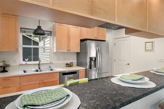132 Sudden Valley Dr, Bellingham, WA 98229 - kitchen with a sink, stainless steel appliances, light brown cabinets, tasteful backsplash, and dark countertops