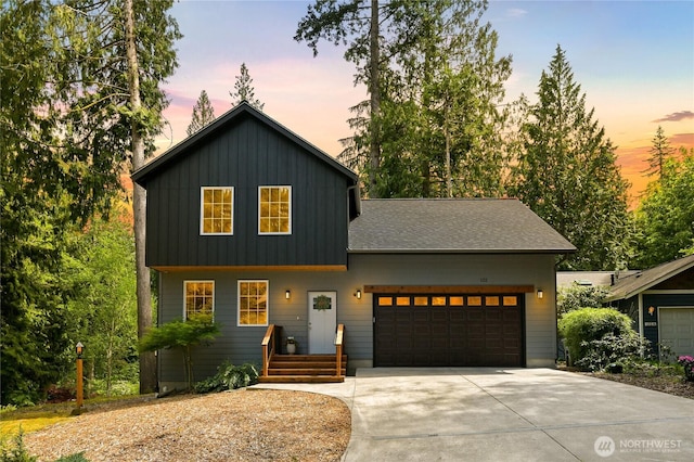 132 Sudden Valley Dr, Bellingham, WA 98229 - view of front of home featuring concrete driveway, board and batten siding, an attached garage, and a shingled roof