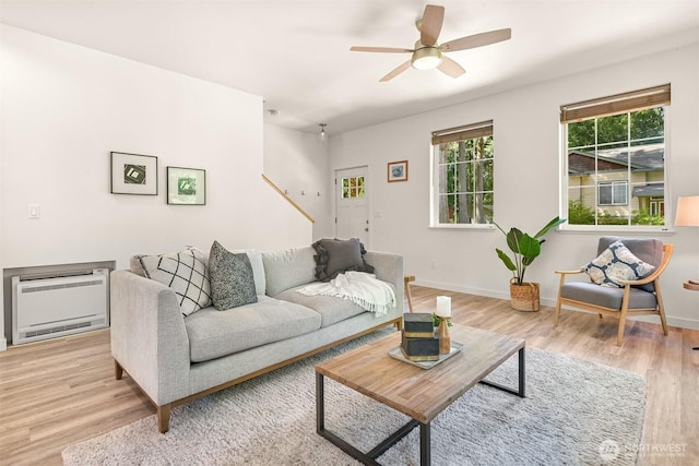 132 Sudden Valley Dr, Bellingham, WA 98229 - living area featuring heating unit, light wood-type flooring, a ceiling fan, and baseboards