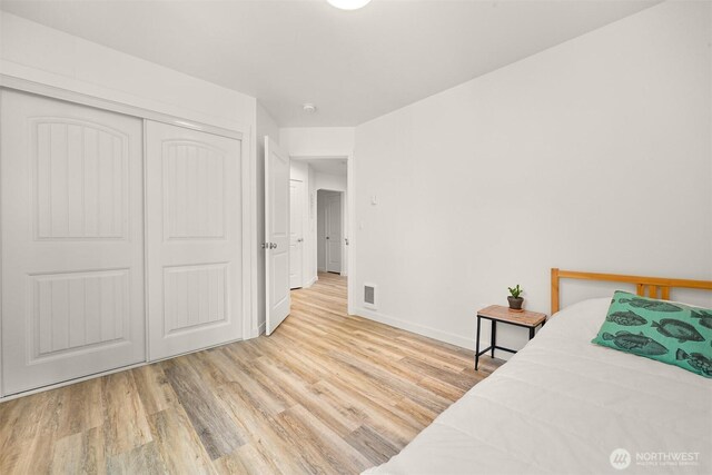 132 Sudden Valley Dr, Bellingham, WA 98229 - bedroom with wood finished floors, baseboards, and a closet