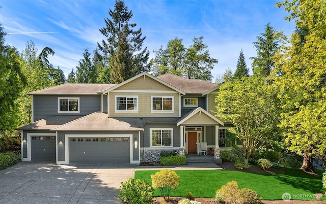 9437 NE Coral Ct, Bainbridge Island, WA 98110 - craftsman-style house featuring concrete driveway, a front yard, an attached garage, and roof with shingles