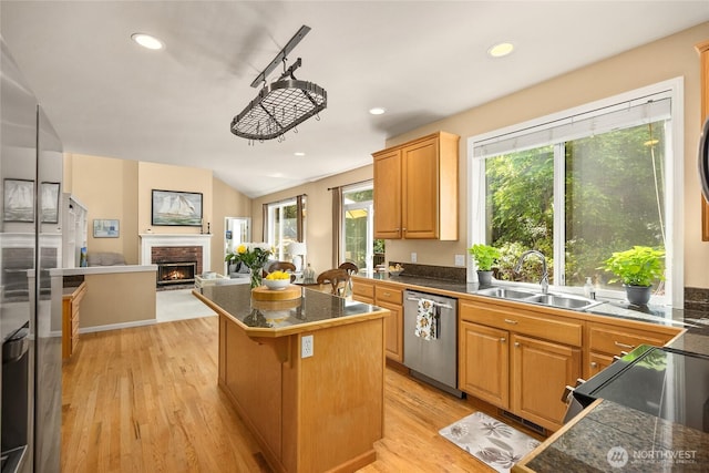9437 NE Coral Ct, Bainbridge Island, WA 98110 - kitchen with dishwasher, a sink, tile countertops, a brick fireplace, and recessed lighting