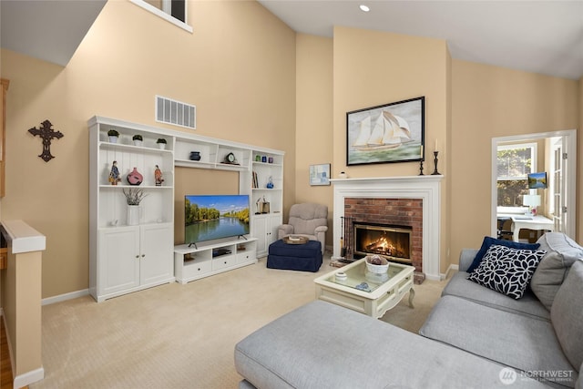 9437 NE Coral Ct, Bainbridge Island, WA 98110 - carpeted living room featuring a fireplace, high vaulted ceiling, and baseboards