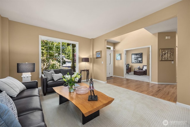 9437 NE Coral Ct, Bainbridge Island, WA 98110 - carpeted living room with baseboards and wood finished floors