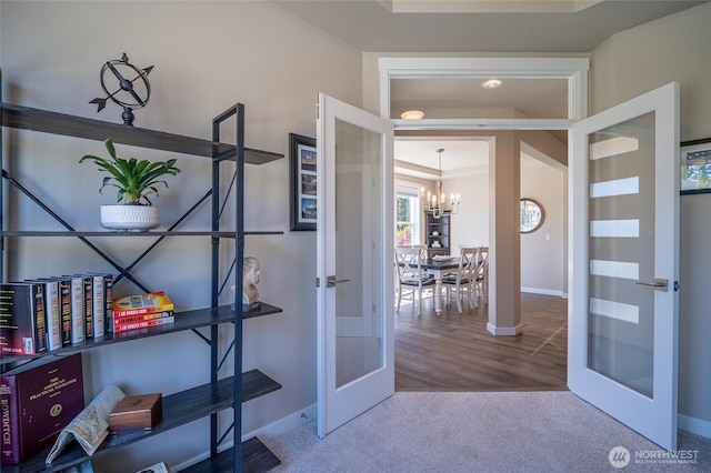 4213 Caddyshack Dr NE, Lacey, WA 98516 - doorway featuring french doors, a chandelier, carpet flooring, and baseboards