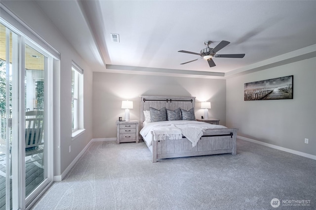 4213 Caddyshack Dr NE, Lacey, WA 98516 - bedroom featuring light carpet, access to exterior, baseboards, and a raised ceiling
