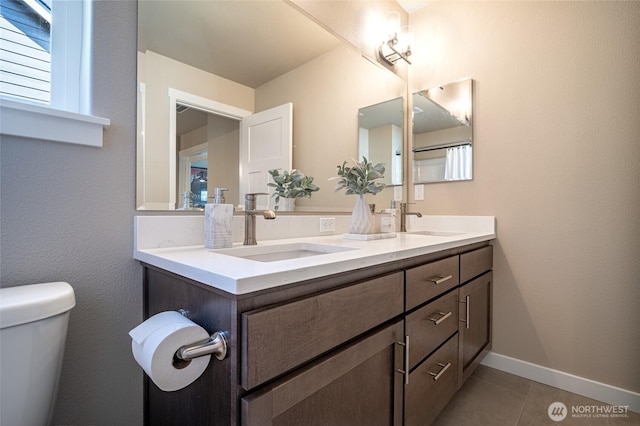 4213 Caddyshack Dr NE, Lacey, WA 98516 - full bath with tile patterned floors, toilet, double vanity, and baseboards