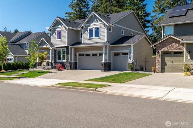 4213 Caddyshack Dr NE, Lacey, WA 98516 - craftsman house featuring stone siding, driveway, and an attached garage