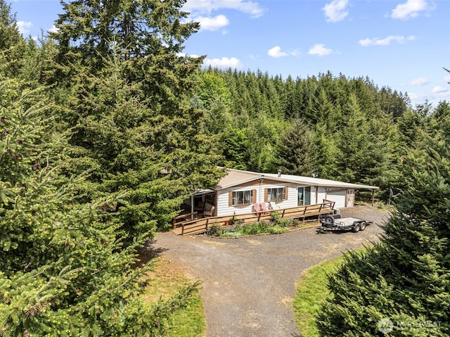 302 Hemenway Rd, Winlock, WA 98596 - view of front facade featuring asphalt driveway and a wooded view