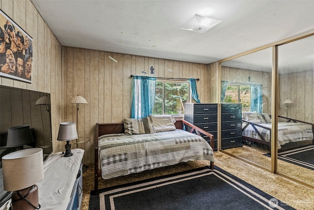 302 Hemenway Rd, Winlock, WA 98596 - carpeted bedroom with wooden walls and a closet