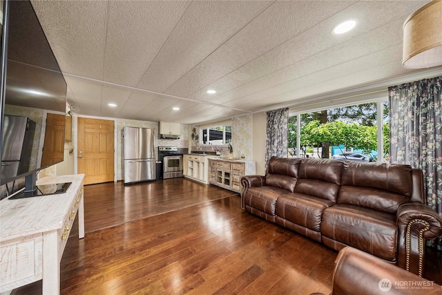 1921 208th St E Unit 9, Spanaway, WA 98387 - living room featuring dark wood-style flooring, recessed lighting, and a textured ceiling