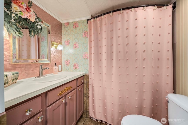 1921 208th St E Unit 9, Spanaway, WA 98387 - bathroom featuring toilet, wallpapered walls, vanity, crown molding, and tile patterned floors