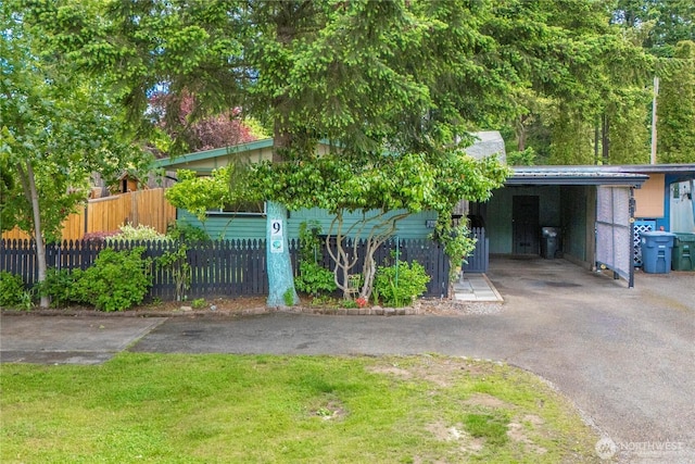 1921 208th St E Unit 9, Spanaway, WA 98387 - obstructed view of property with asphalt driveway and an attached carport