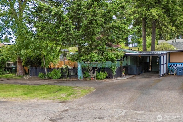 1921 208th St E Unit 9, Spanaway, WA 98387 - view of front facade with driveway and an attached carport