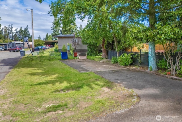 1921 208th St E Unit 9, Spanaway, WA 98387 - view of property hidden behind natural elements with asphalt driveway