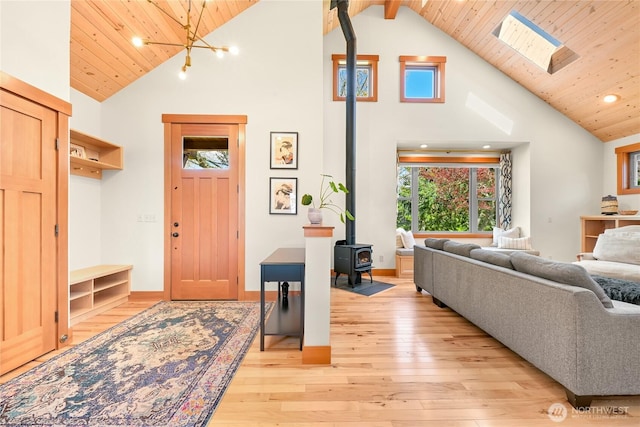 2518 S Park Dr, Bellingham, WA 98225 - living room with a wood stove, wood ceiling, high vaulted ceiling, light wood finished floors, and recessed lighting