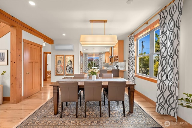 2518 S Park Dr, Bellingham, WA 98225 - dining area featuring a wall mounted air conditioner, light wood-style flooring, baseboards, and recessed lighting