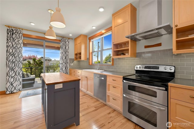 2518 S Park Dr, Bellingham, WA 98225 - kitchen with appliances with stainless steel finishes, wall chimney range hood, a sink, light brown cabinets, and recessed lighting